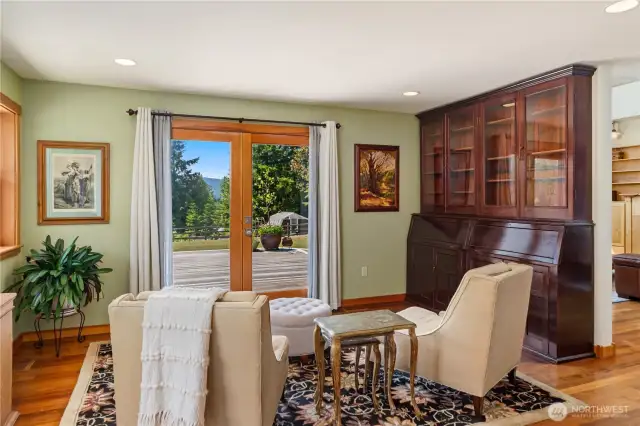 This space is called the gathering room right off the kitchen. The antique cabinet stays with home.