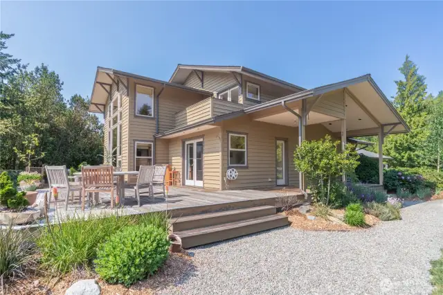 The expansive deck looks towards the Olympics and private 4+ acre property.