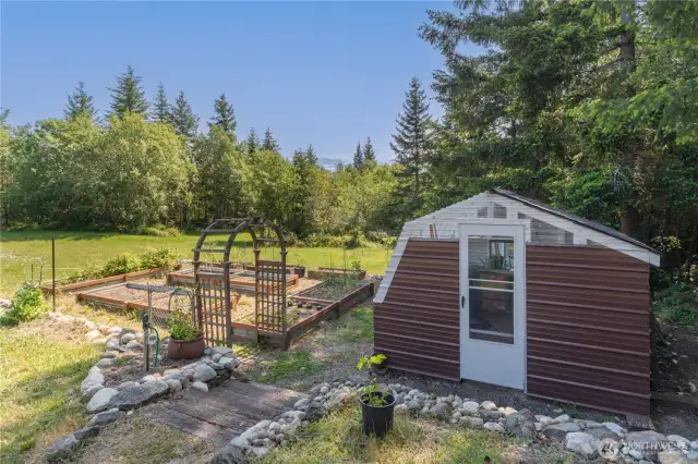 Greenhouse and garden beds.