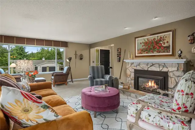 This Grand-Piano Sized Formal Living Room also has a Gas Fireplace and Triple-Bank of NW Facing windows
