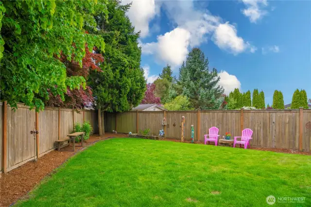 Fully-Fenced Private Yard is surrounded by mature trees, enough lawn for pets and little-ones to run around and play to their hearts content.