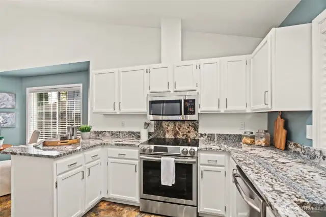 Updated kitchen with stainless appliances.
