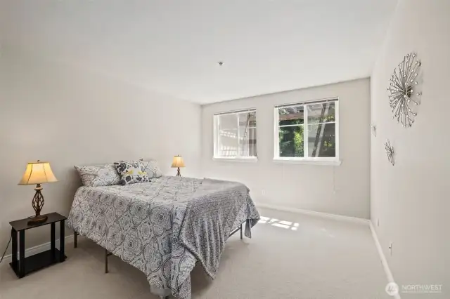 Primary bedroom is large. This is a queen bed and you can see a King would fit easily with lots of space left over.