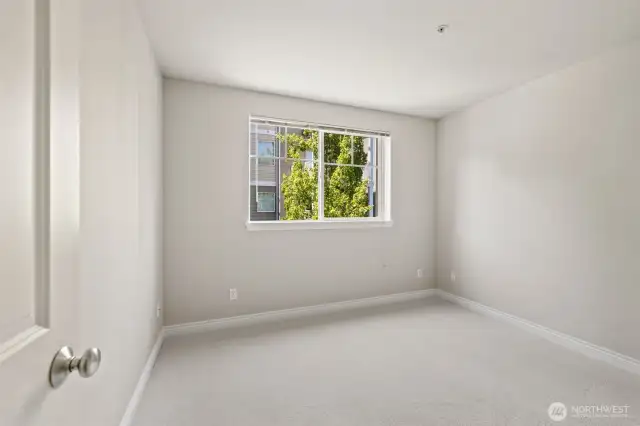 2nd bedroom is a good size that this picture doesn't quiet capture. Has a large closet & large window.