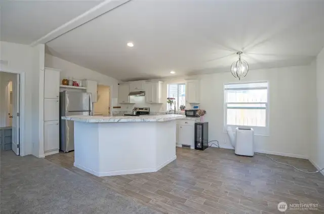 Enjoy open-concept living with a stylish island kitchen and convenient bar seating for casual dining.