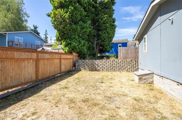 Backyard features a privacy fence separating you from the neighbor.
