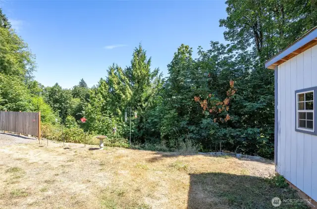 The side yard is perfect for relaxing, with fencing that ensures privacy.