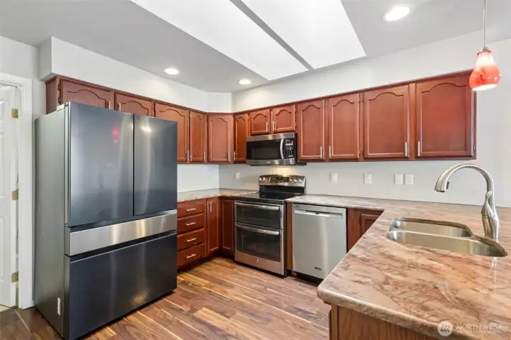 updated kitchen with newer appliances, counters and cabinets