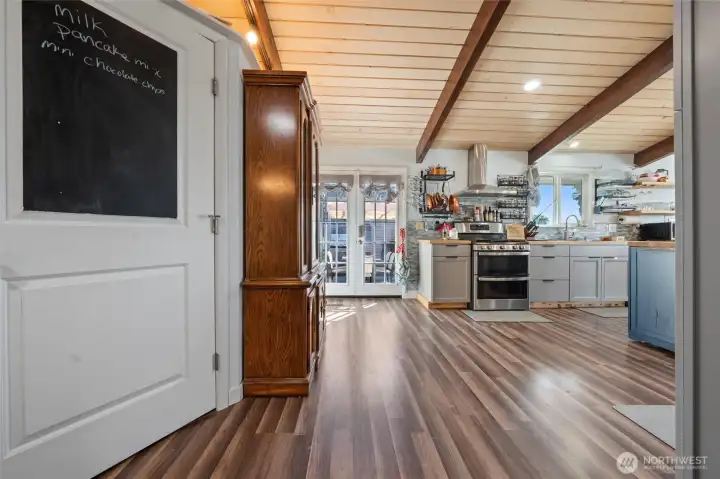 The open concept kitchen, living and dining room feature new updates throughout.