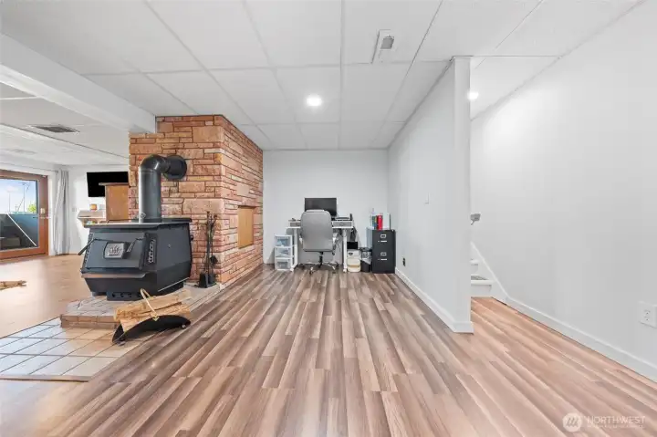 This area was once a kitchen with a doorway to the 3/4 bathroom and bookshelf area.  The power is still available for a stove and the water access is caped off in the wall.