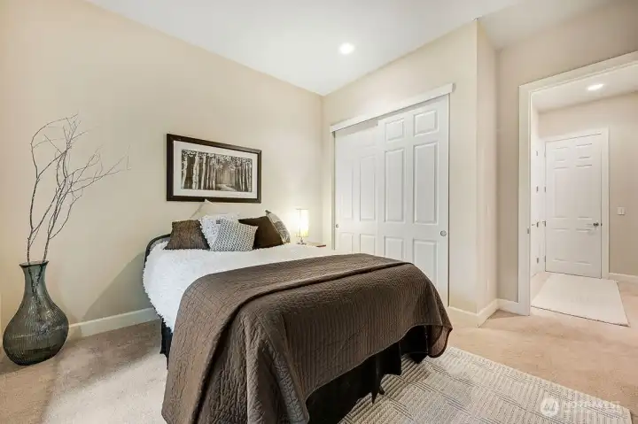 his cozy guest bedroom offers a welcoming retreat for friends or family, just steps from the guest bathroom for convenience. Its bright, comfortable layout makes it easy for visitors to feel right at home.
