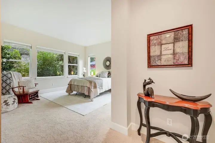 Roomy and inviting, the primary bedroom offers views of the surrounding landscape through generous windows, along with a private ensuite for comfort and convenience.