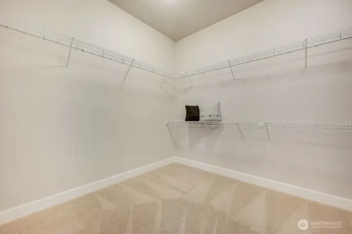 An amazing walk-in closet with room for everything—clothes, shoes, and all your accessories can be neatly organized and easily accessed.