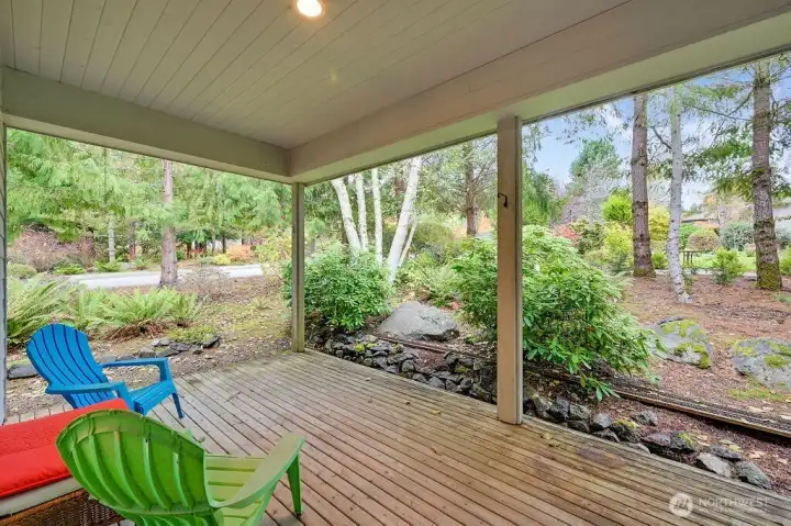 This spacious covered backyard patio easily accommodates two separate seating areas—a true treat for relaxing or entertaining.