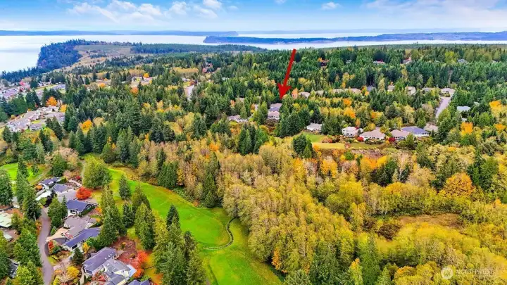 Aerial: This home enjoys a prime location near the Port Ludlow Golf Course, marina, local dining, and miles of maintained hiking trails—perfectly blending convenience with scenic surroundings.