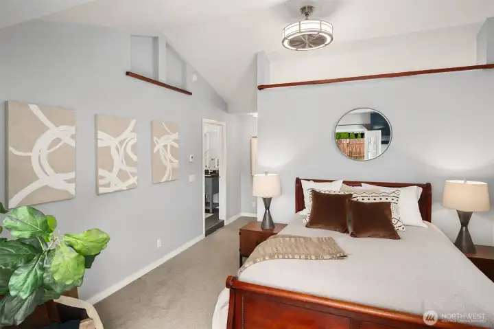 Primary suite features vaulted ceilings and high-end fan, french doors to patio where you can enjoy your morning coffee!