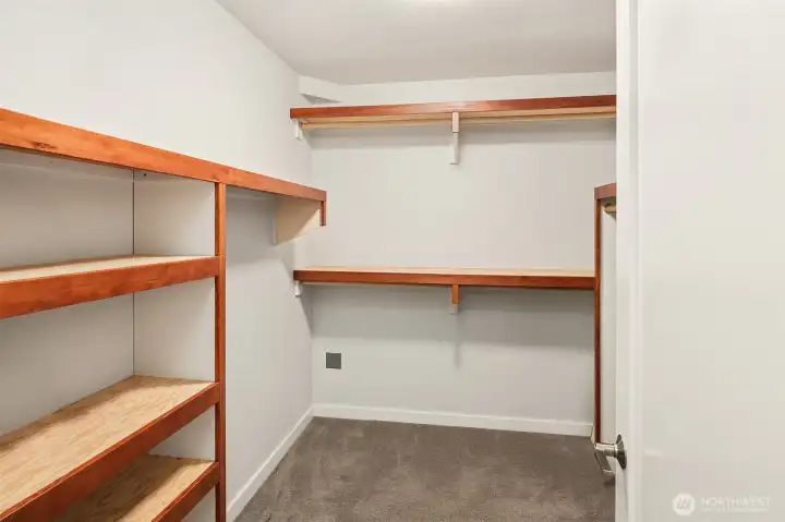 Walk-in closet in primary with custom shelving