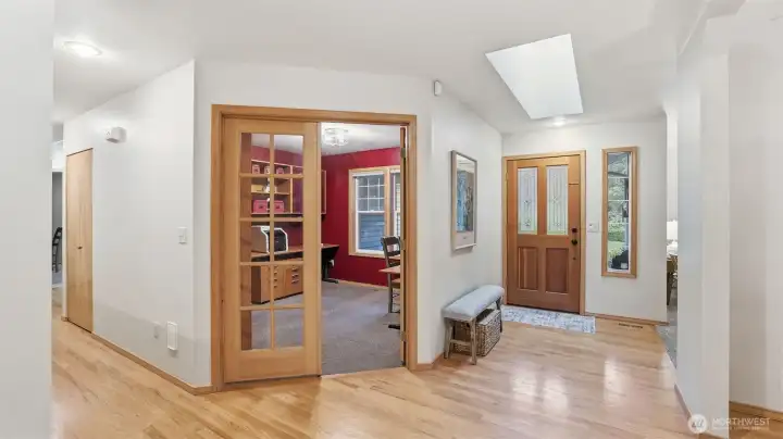 Looking back at the entry and 4th bed/den