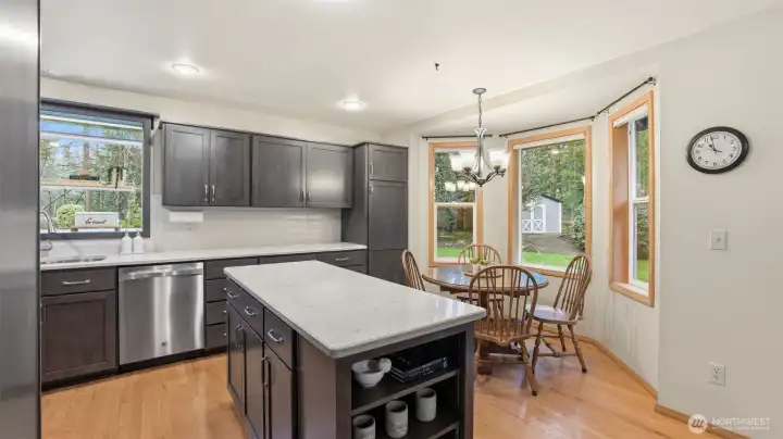 Cozy sunken family room with gas fireplace & built-ins
