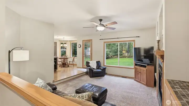 Cozy sunken family room with gas fireplace & built-ins