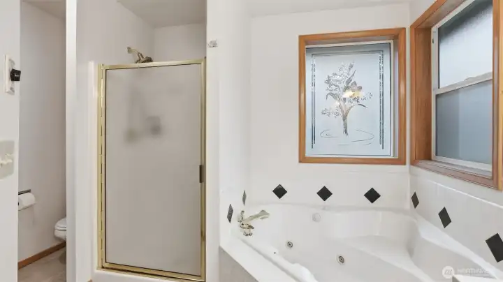 Primary suite bathroom with newly updated counters and flooring