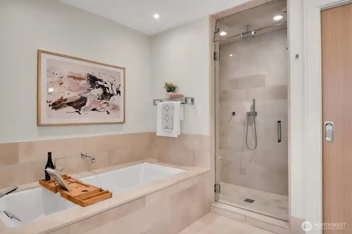 A look at the soaking tub and steam shower in the primary bathroom.