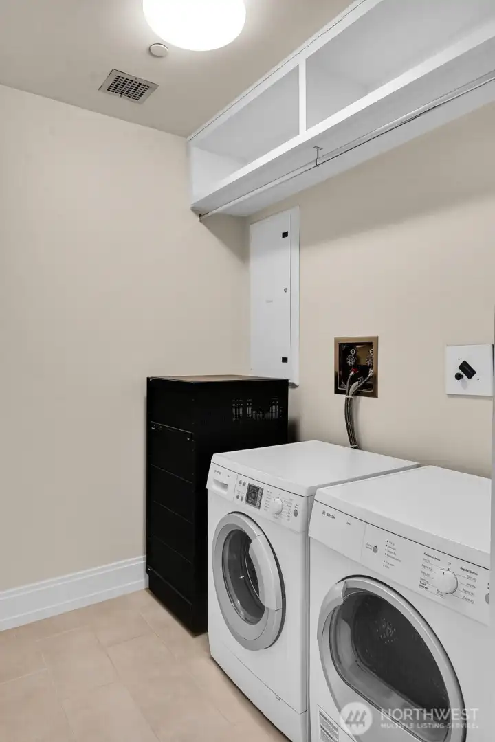 A convenient utility room is found in this unit.