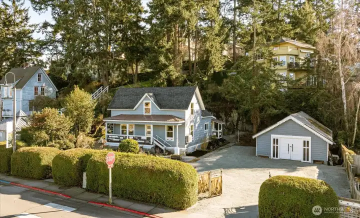 Quintessential La Conner cottage surrounded by mature landscaping offering a feeling of privacy, even while on the main street into town!