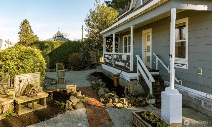 The inviting front porch offers the perfect place to relax and enjoy the quiet charm of this historic coastal town.