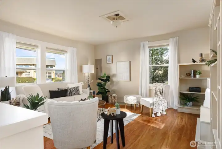 Soft light, warm floors, and thoughtful built-ins create a space that feels calm, comfortable, and easy to settle into.