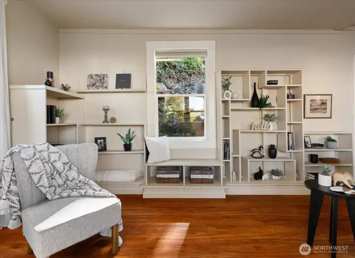 Custom built-ins add both charm and character, offering beautiful display space while anchoring the room with timeless style.