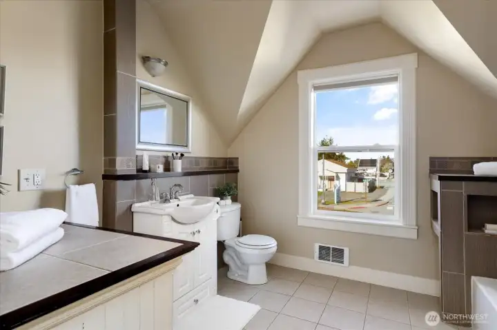 Natural light pours through the window, giving the bathroom an airy, refreshing feel.