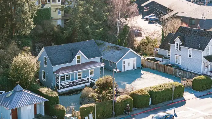 The property’s generous lot and detached shop stand out in town, offering space and flexibility rarely found this close to the waterfront.