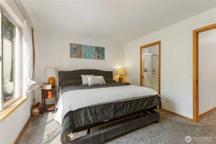 Primary bedroom looking toward the bathroom and the walk in closet..