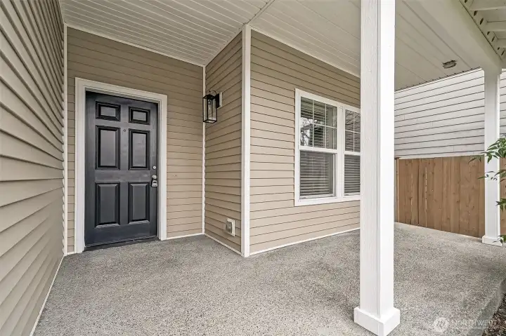 Nicely covered front porch allows entry out of the elements.