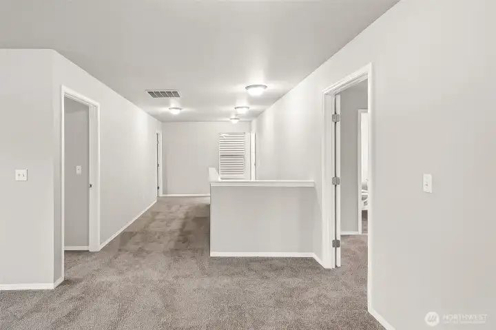 Fresh neutral paint and new carpet opens the upstairs.