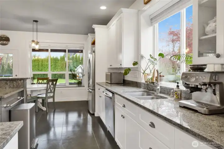 Open-concept layout connecting kitchen, dining, and living spaces