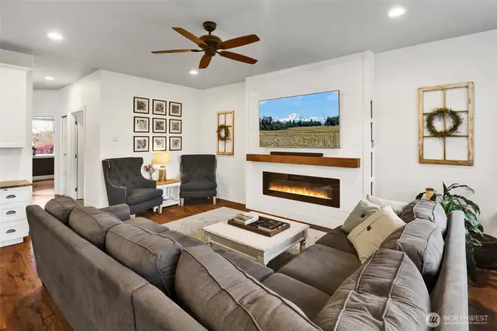 Comfortable family room with fireplace and large windows