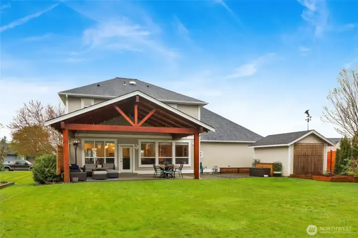 Rear exterior showcasing patio and backyard layout