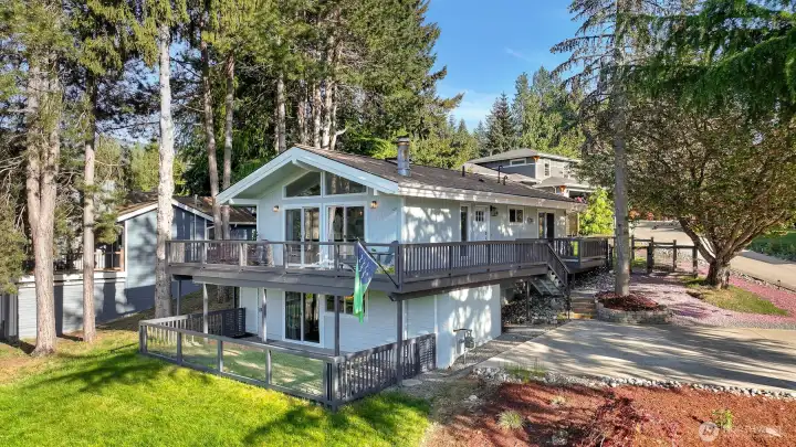 Updated exterior with expansive wraparound deck and elevated Lake Whatcom views.
