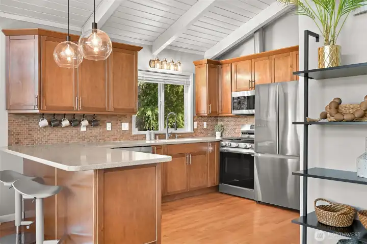 Updated kitchen with stainless steel appliances, generous cabinetry, and a functional layout that keeps everything within reach.