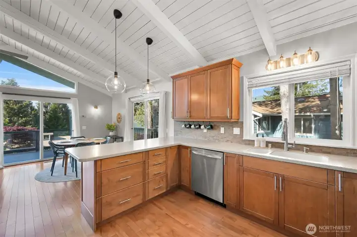 Kitchen and dining areas connect naturally, creating a comfortable setting for daily routines, casual meals, and entertaining.