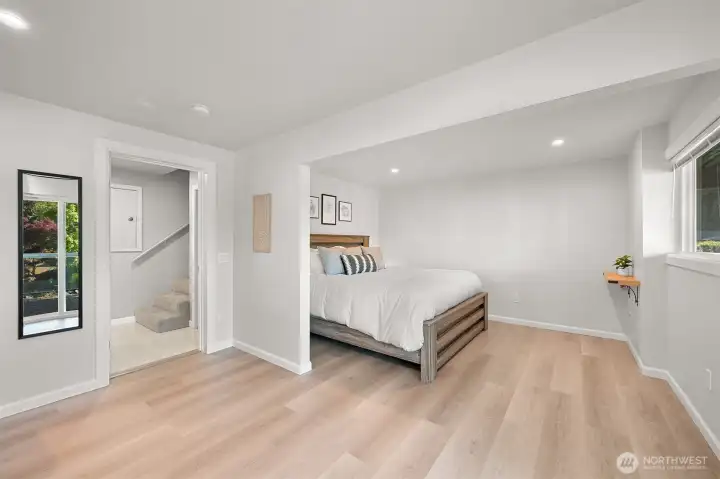 Spacious lower-level suite with private exterior access and abundant natural light.
