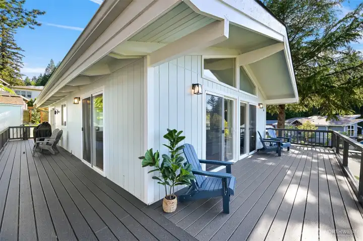 Wraparound deck connects your back yard and extends the living space outdoors with multiple seating areas.