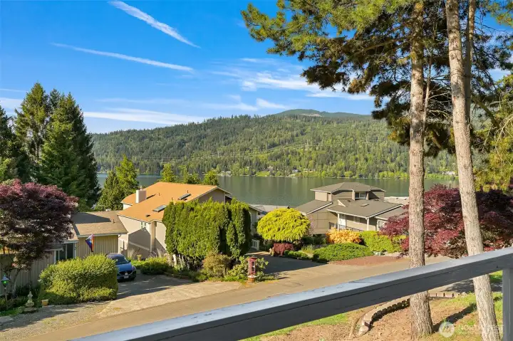 Elevated setting overlooking Lake Whatcom with a blend of water views, mature evergreens, and surrounding natural beauty.