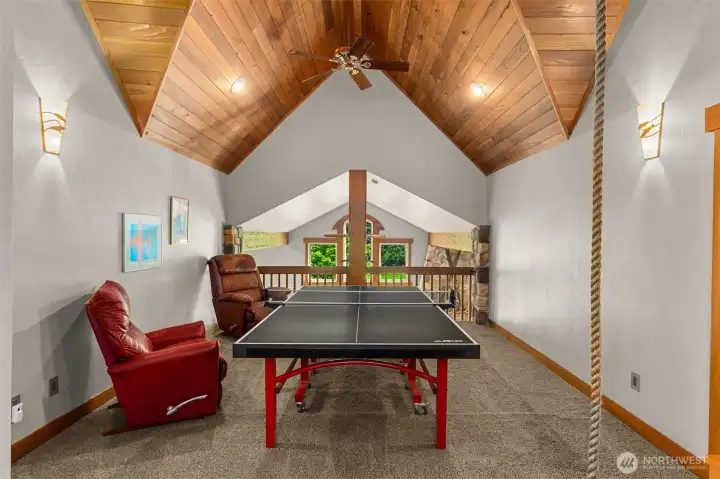 Upstairs in one upper wing (ther are two) you find this great loft/bonus space - perfect for games, hanging out (literally....there is a climbing rope!)