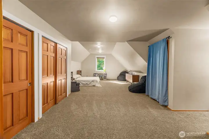 Upper bedroom features dual closets and vaulted ceiling and room for a crowd!