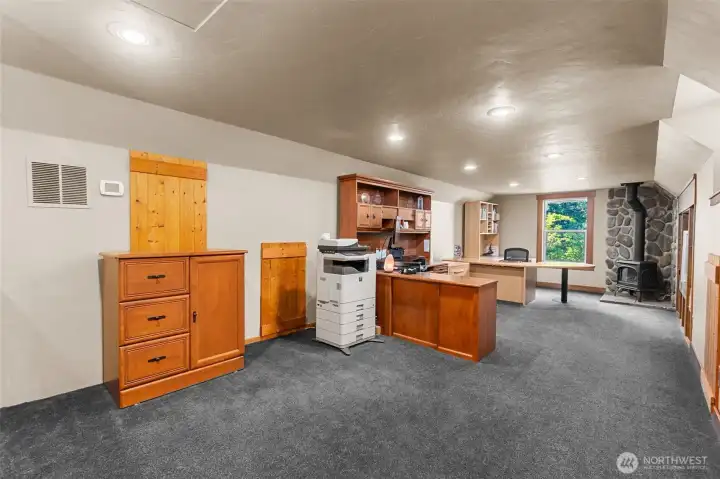 Upper wing #2 features this terrific office space with cozy gas stove for a great work-from-home set up. Or use it as a bonus/play room