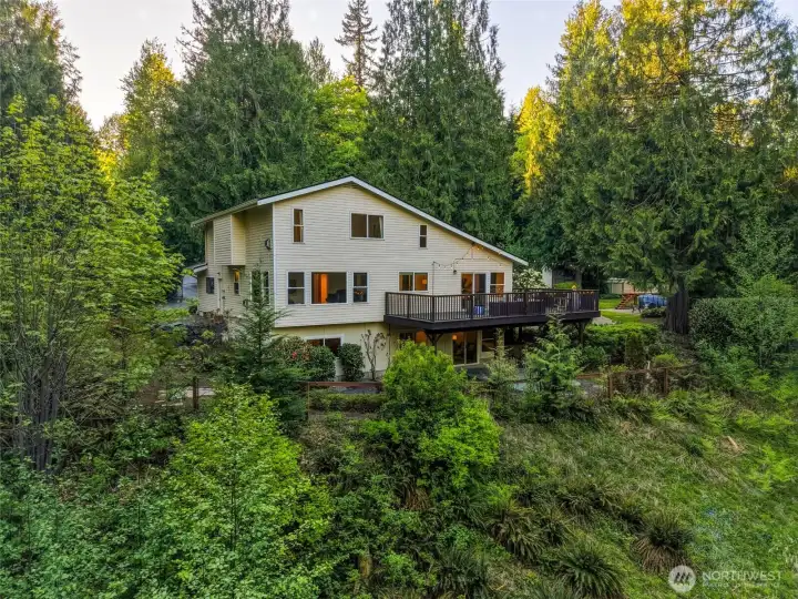 Enjoy outdoor living with a deck and patio off the home plus a separate poolside deck and patio—perfect for relaxing or entertaining.