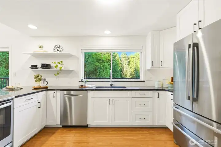 Chef’s kitchen with stainless appliances.
